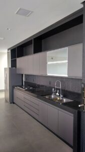 grey kitchen interior with black counter top