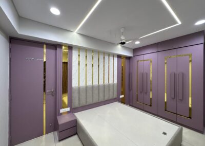Bedroom interior with purple wardrobe shutters, vertical panel detailing, and POP ceiling lights