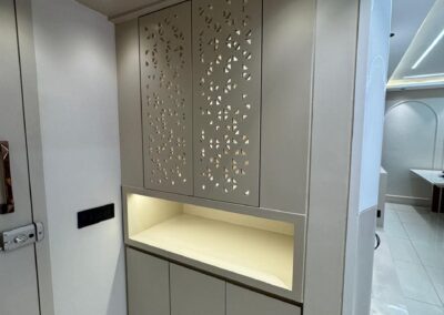 Home mandir design with CNC back panel, open prayer niche, and closed storage unit below designed by J Designs